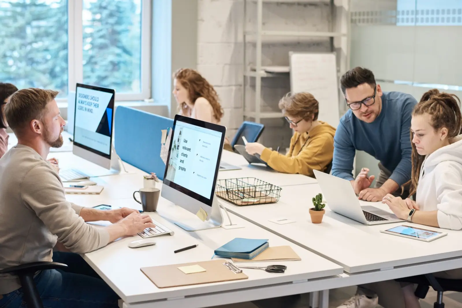 Nexzem designers and engineers working together at their desks